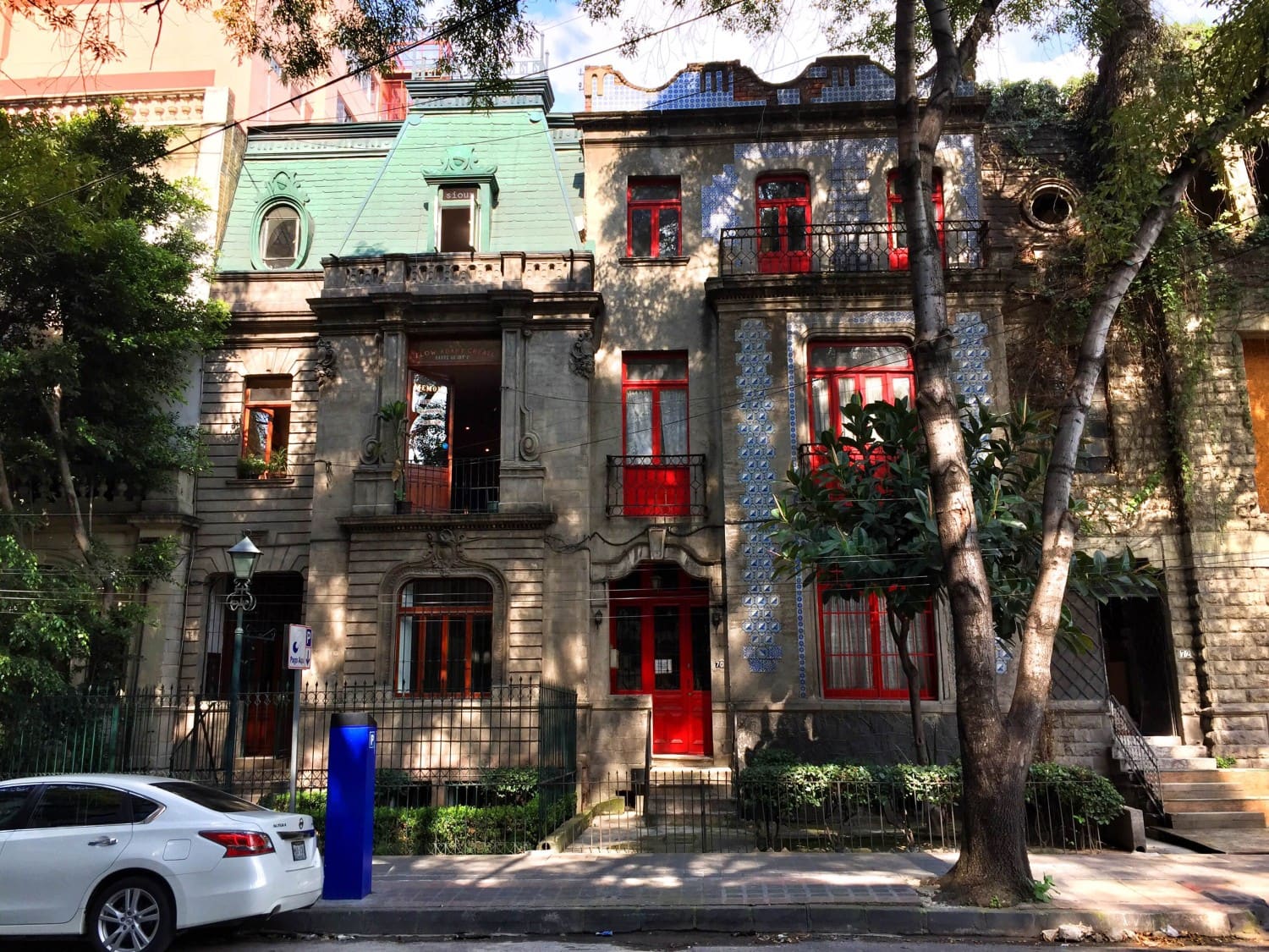 Historic art deco buildings on a tree-lined street in Colonia Juárez, Mexico City